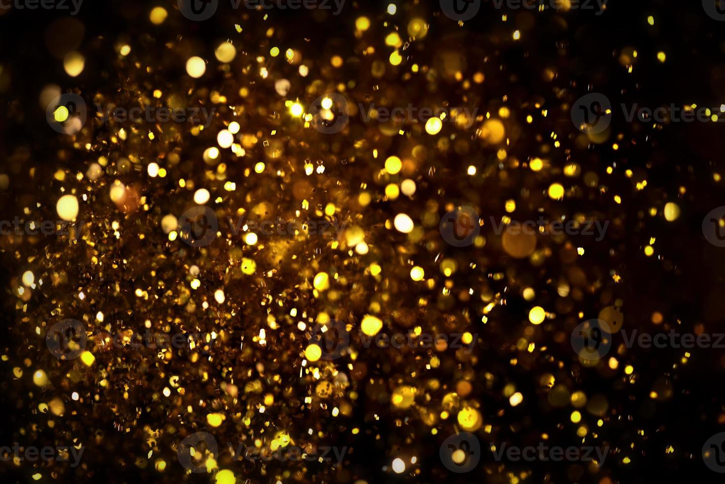 textura de iluminação de bokeh de brilho dourado turva fundo abstrato para aniversário, aniversário, casamento, véspera de ano novo ou natal foto