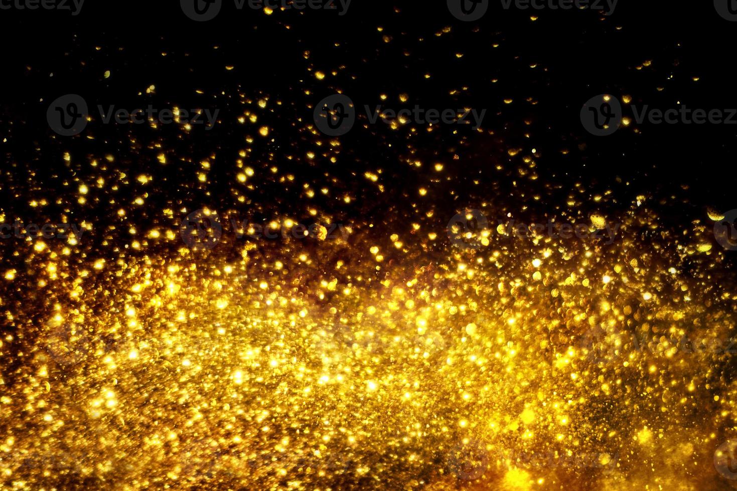 textura de iluminação de bokeh de brilho dourado turva fundo abstrato para aniversário, aniversário, casamento, véspera de ano novo ou natal foto