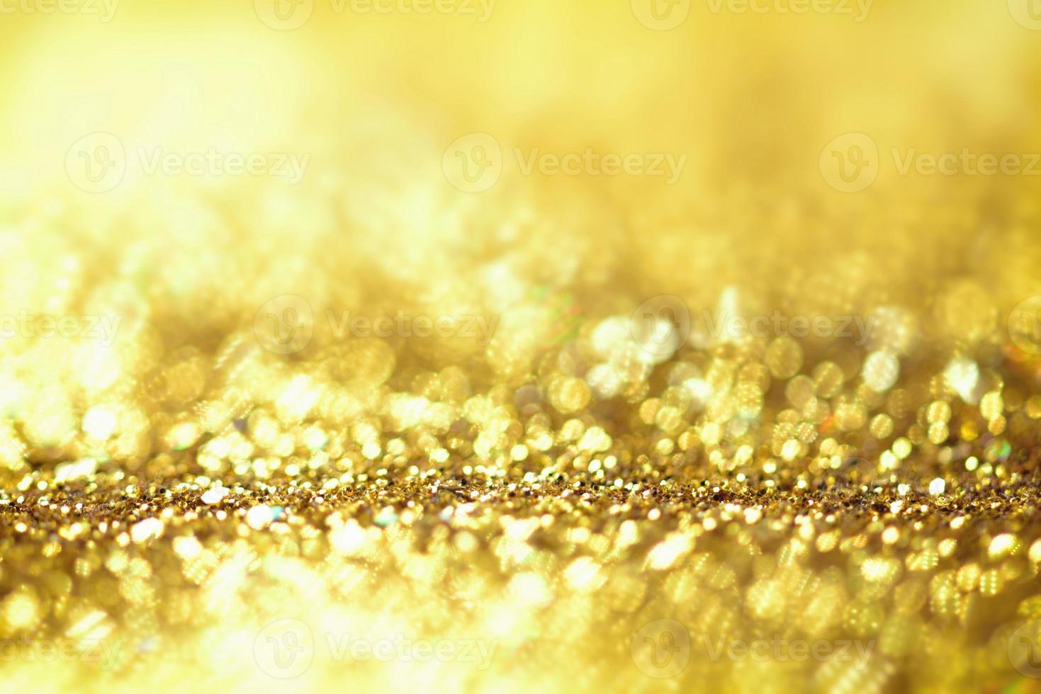 textura de iluminação de bokeh de brilho dourado turva fundo abstrato para aniversário, aniversário, casamento, véspera de ano novo ou natal foto