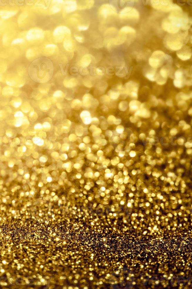 textura de iluminação de bokeh de brilho dourado turva fundo abstrato para aniversário, aniversário, casamento, véspera de ano novo ou natal foto