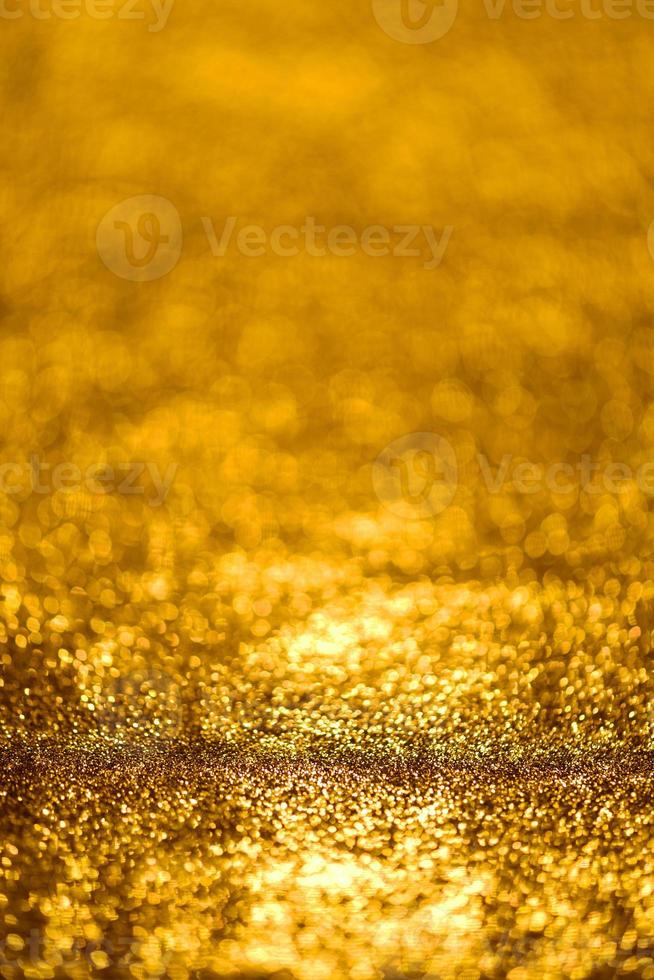 textura de iluminação de bokeh de brilho dourado turva fundo abstrato para aniversário, aniversário, casamento, véspera de ano novo ou natal foto