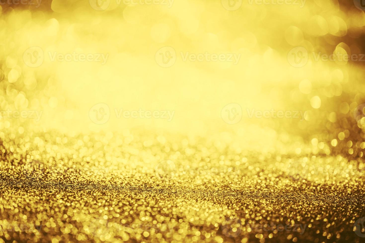 textura de iluminação de bokeh de brilho dourado turva fundo abstrato para aniversário, aniversário, casamento, véspera de ano novo ou natal foto