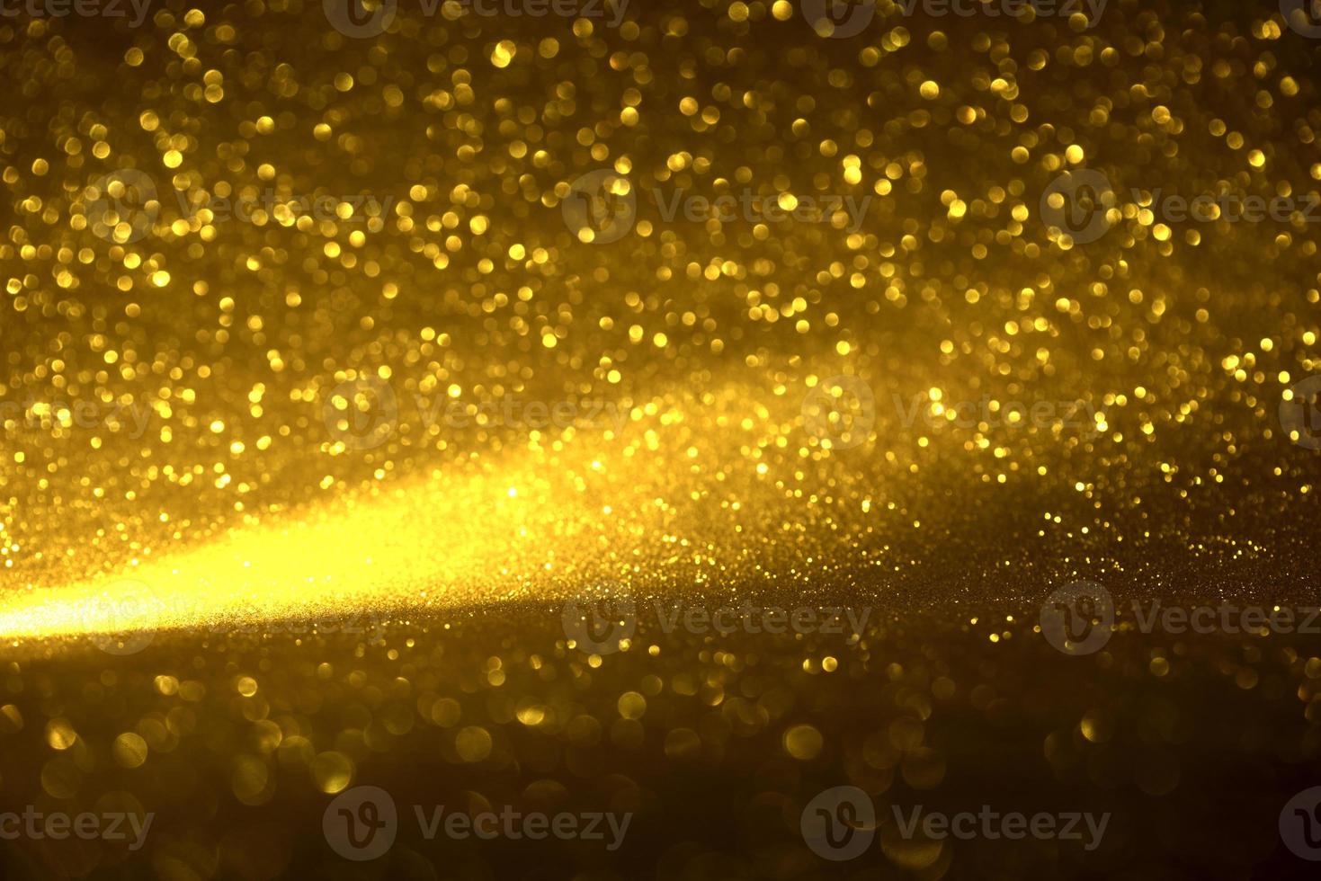 textura de iluminação de bokeh de brilho dourado turva fundo abstrato para aniversário, aniversário, casamento, véspera de ano novo ou natal foto