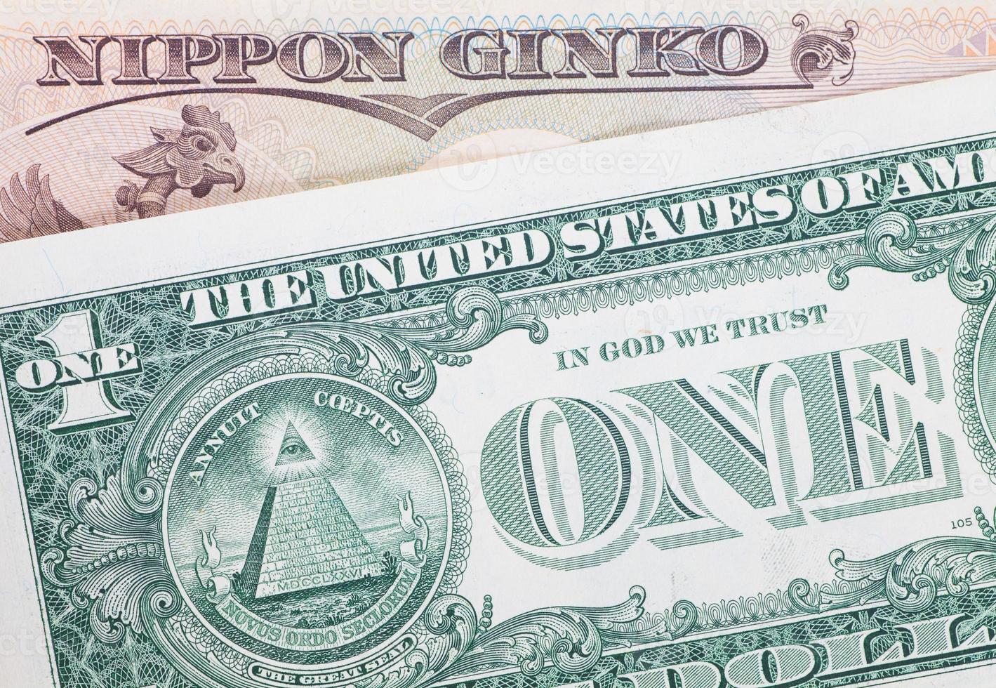 as notas de dólar iene japonês para o conceito de negócios e finanças foto