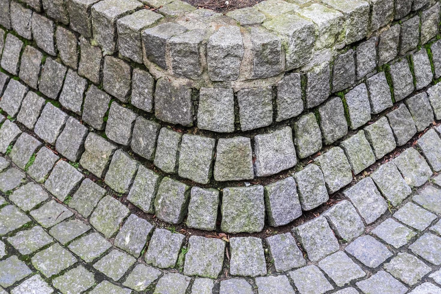 detalhado close-up em antigas estradas e passarelas históricas de paralelepípedos foto