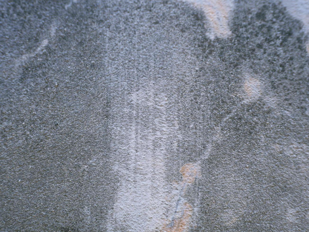 cimento velho ou parede exterior de concreto com manchas e mofo para segundo plano. foto