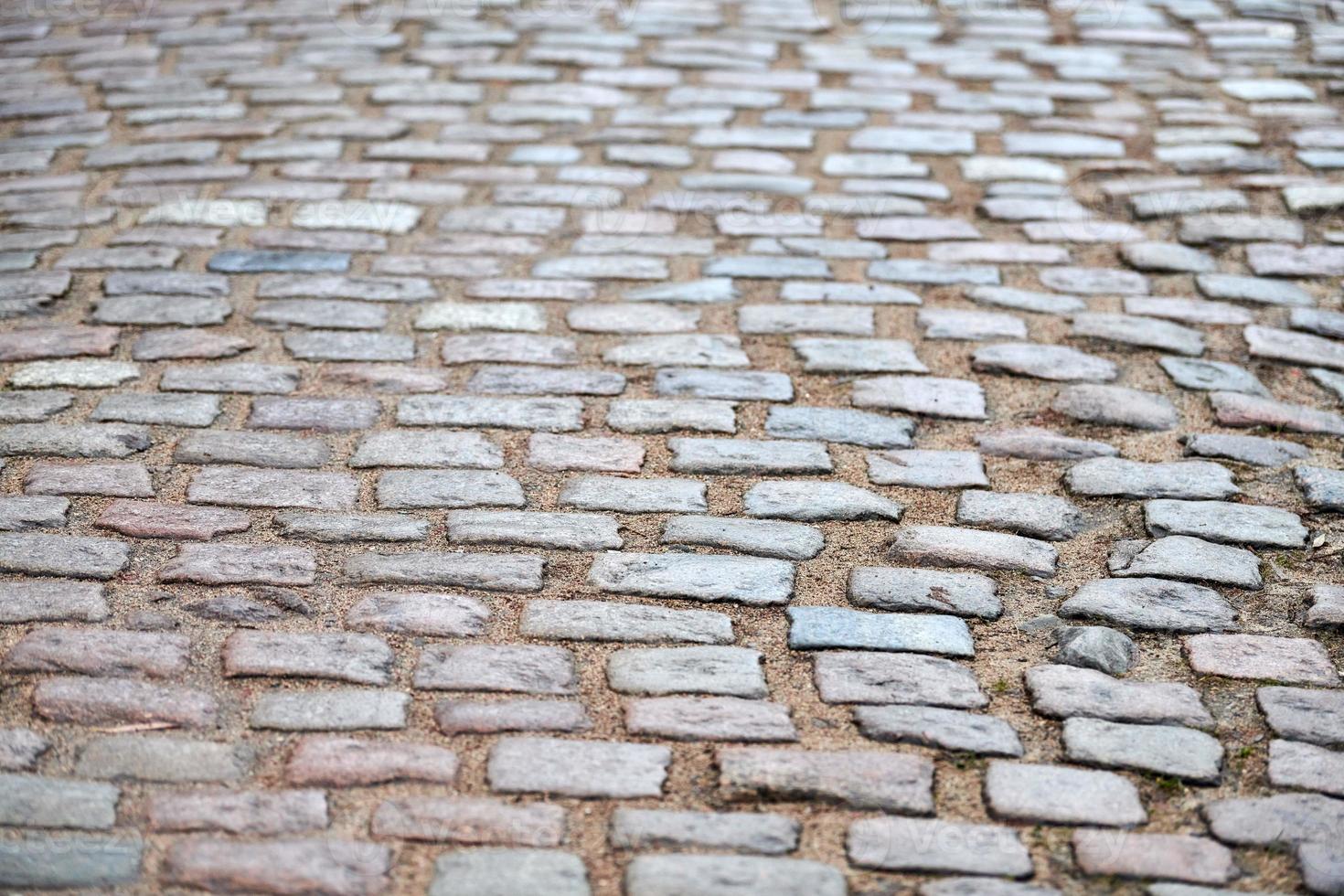 pedras de pavimentação na rua da cidade foto