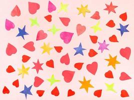 colagem de várias estrelas e corações em papel rosa foto