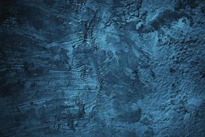 fundo de parede de estuque azul grunge abstrato. fundo de conceito de parede de pedra escura com espaço para texto. foto
