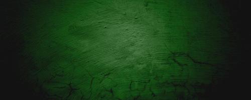 fundo de textura de parede verde. fundo de halloween assustador. fundo verde e preto grunge com arranhões foto