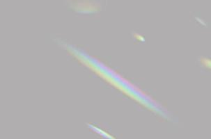 resumo da sobreposição de luz de prisma de arco-íris turva em fundo cinza para maquete e decoração foto