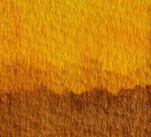 fundo de arte de pintura de mão em aquarela amarelo e marrom. conceito de tom de terra para cores naturais de solo ou solo. foto