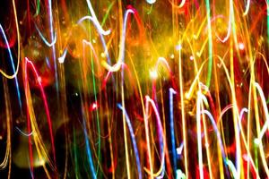 fundo abstrato textura burred do movimento do bokeh colorido. longa exposição de pequenas luzes de néon foto