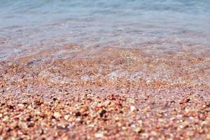 close-up da praia de areia do mar ou oceano como pano de fundo foto