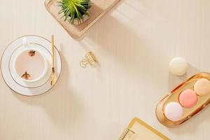 mesa de escritório em casa estilizada ouro moderno com pasta, biscoitos, caneca de café em fundo bege. postura plana, conceito de estilo de vida de vista superior. foto