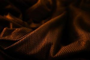 textura abstrata de pano de rede de ouro premium elegante com fundo preto foto