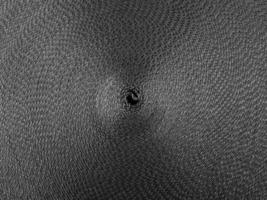 padrão circular abstrato preto feito de funda preta foto