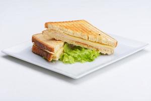 sanduíche na superfície branca foto