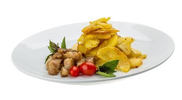 carne de porco frita com batata foto