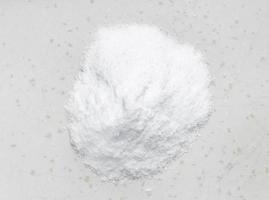 vista superior da pilha de açúcar dextrose closeup em cinza foto