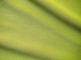 textura de jersey de tecido de roupas esportivas verdes foto