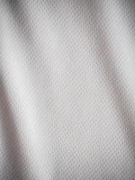 fundo de textura de tecido de camisa esportiva branca foto