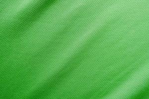 textura de jersey de tecido de roupas esportivas verdes foto
