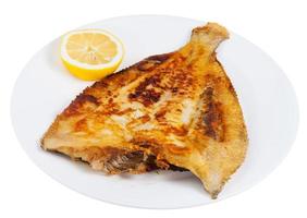 peixe linguado frito na chapa branca foto