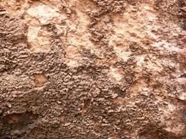 a textura da pedra usada para imagens de fundo, superfície de pedra cor marrom foto