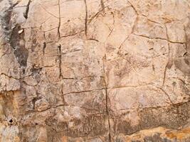 a textura da pedra usada para imagens de fundo, superfície de pedra cor marrom foto