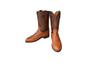 botas de cowboy marrons em um fundo branco. foto