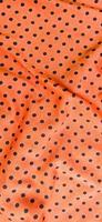 Efeitos fotográficos de onda 3D criados a partir de tecido com padrão de bolinhas laranja vermelho foto
