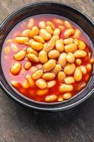 feijão molho de tomate feijão prato refeição comida lanche na mesa cópia espaço foto