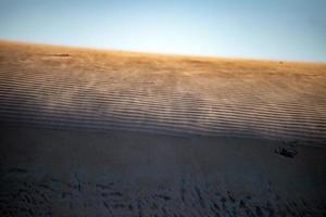vista da paisagem das dunas de areia da praia foto