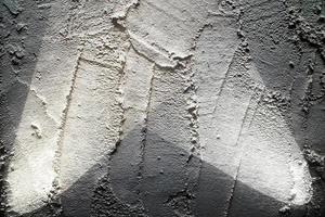 close-up vista em texturas de parede de concreto com três holofotes foto