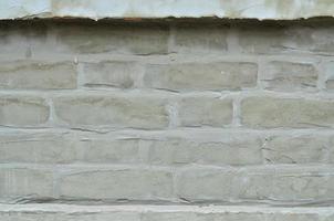 textura de parede de tijolo velha resistida e manchada foto