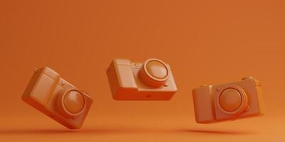 câmera digital laranja em fundo laranja, conceito de tecnologia. renderização em 3D foto
