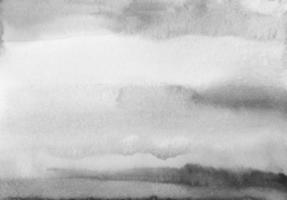 textura de fundo preto e branco em aquarela. manchas monocromáticas na sobreposição de pano de fundo de papel. pintura abstrata de aquarela cinza. foto