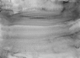textura de fundo líquido cinza neutro em aquarela. manchas monocromáticas na sobreposição de pano de fundo de papel. pintura abstrata de aquarela preto e branco. foto