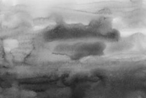 fundo cinza e preto sujo de aquarela. manchas monocromáticas na pintura de papel. pano de fundo abstrato preto e branco. foto