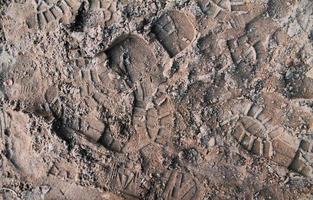 vista detalhada de perto em uma textura de terra de areia marrom foto