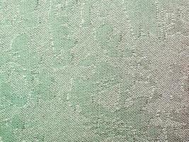 fundo têxtil - tecido de seda batik verde foto