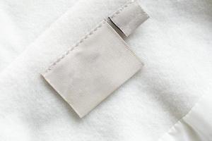 etiqueta de roupas de lavanderia na textura de tecido foto