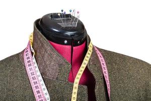 alfaiataria de jaqueta de tweed de homem no manequim foto