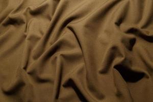 tecido de lona caqui amassado marrom amassado - fundo e textura de quadro completo foto
