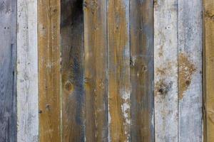 superfície de tábua de pranchas de madeira cinza e marrom seca e seca - fundo e textura de quadro completo foto