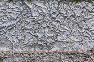 textura e fundo da superfície de isolamento de parede de folha de alumínio grosso amassado foto