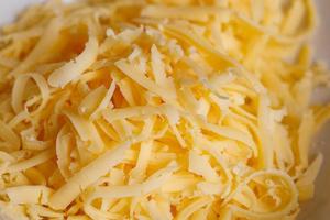 fundo de close-up de quadro completo de queijo ralado com foco seletivo foto