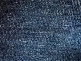 vista superior do fundo de textura de jeans azul com espaço de cópia para design ou texto foto
