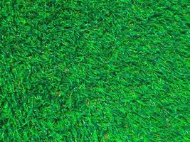 fundo de textura de grama verde artificial com espaço de cópia para trabalho e design. foto